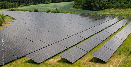 Fototapeta Naklejka Na Ścianę i Meble -  Photovoltaic Solar Farm with black panels as complete facility