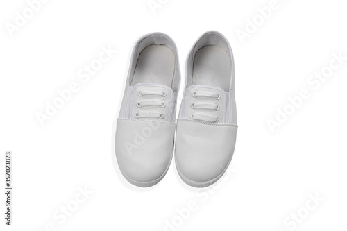 blank pair of white textile sneakers isolated on white background