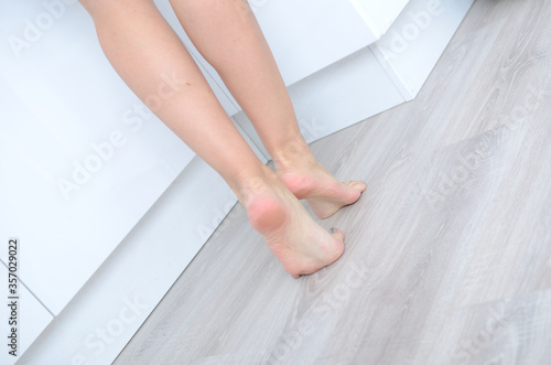 Woman's feet on the floor