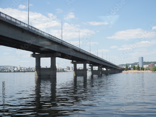 Bridge piers. Bridge interchange on sky background. Modern road junction over the river. Concept - building bridges. Road architecture. © Yulia