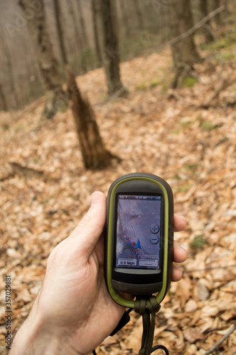 Refrecing a GPS while trail blazing in the forest