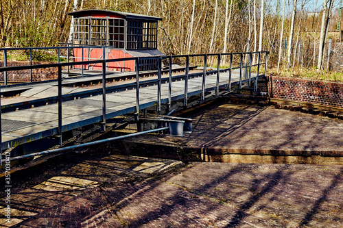 Abandoned railway turntable of a former freight station from the late 19th century in Berlin, Germany. The photo is edited in vintage style. photo