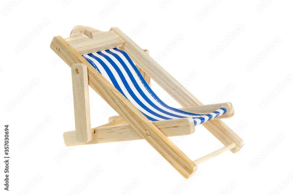 Beach chair isolated on white. Blue and white striped deck chair.