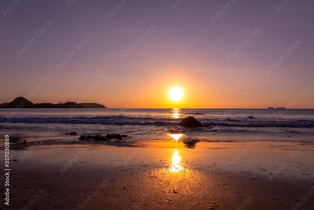 A beautiful beach sunset along the ocean in Costa Rica. A beautiful beach sunset along the ocean in Costa Rica.