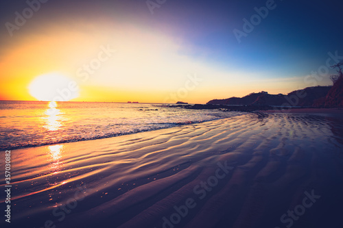 A beautiful beach sunset along the ocean in Costa Rica. © Kris