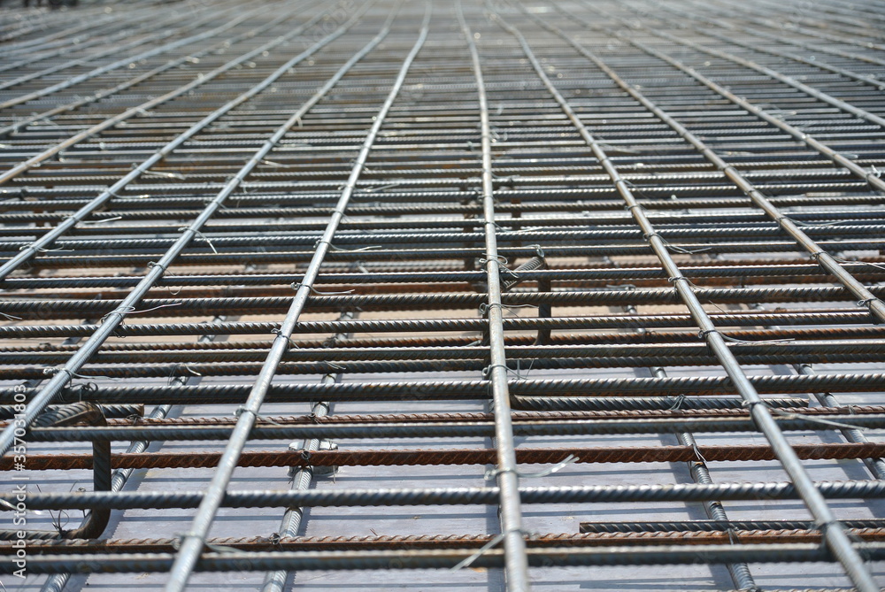 SELANGOR, MALAYSIA -MAY 18, 2016: Hot rolled deformed steel bars or steel reinforcement bar tied together before casting in the concrete. Its function is to increase the concrete strength. 
