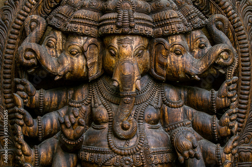  Wooden statue of the Hindu god Ganesha. Hindu god of wisdom and prosperity.