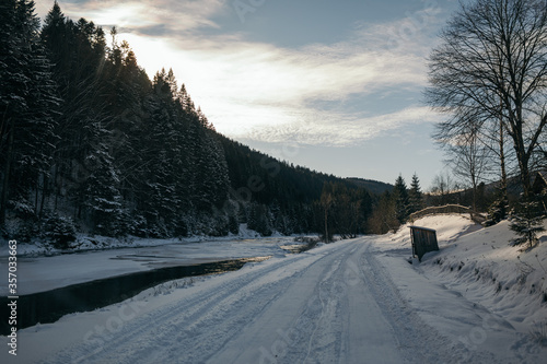 A snow covered road travel
