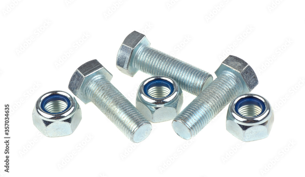 Metal bolt and a lot of nut on a white background, isolated. Metal bolt and a lot of nut on a white background, isolated.