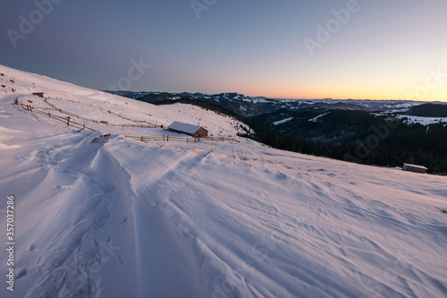A man riding on top of a snow covered mountain © Дмитро Григорчак
