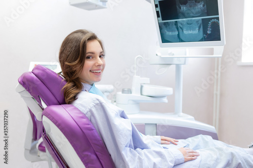 Happy smiling woman at dental clinic. 