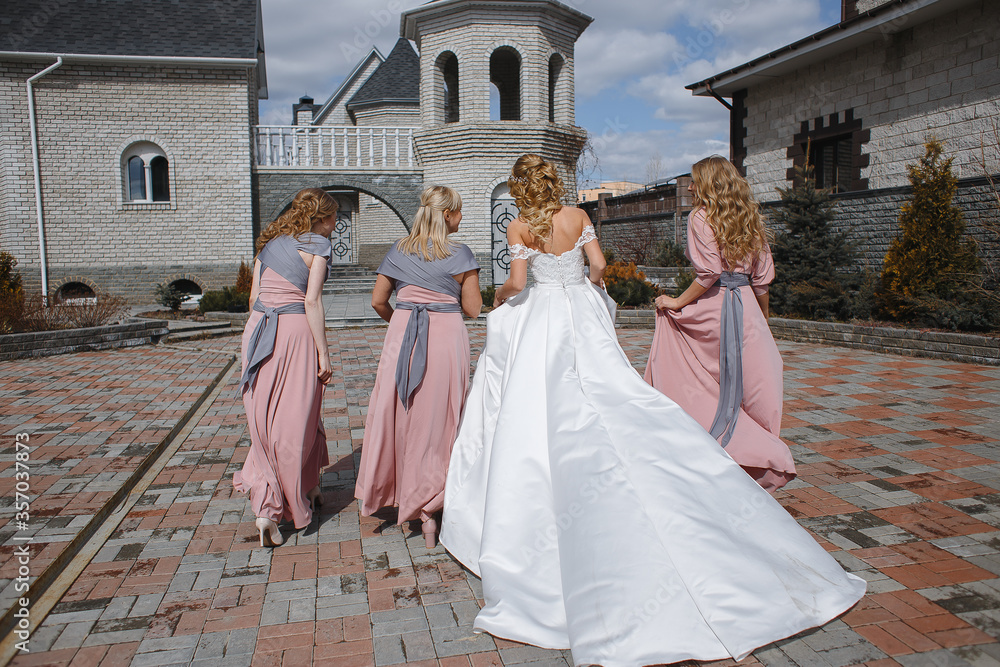 Bride and her bridesmaids in the Park at the castle