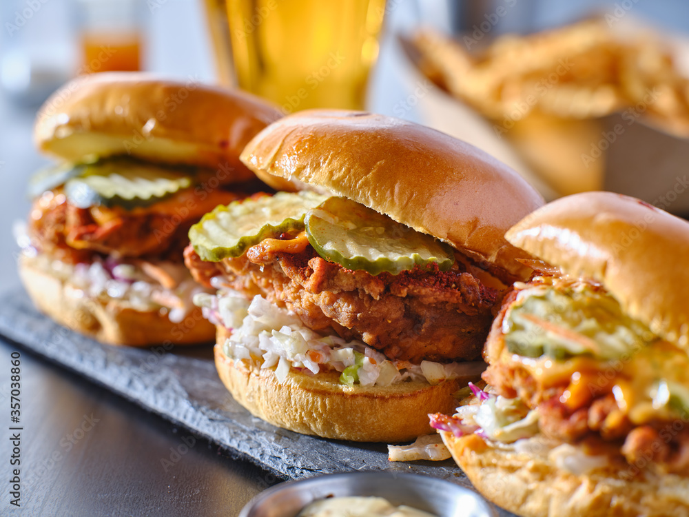 Ταπετσαρία spicy nashville hot chicken sandwich with coleslaw and pickles