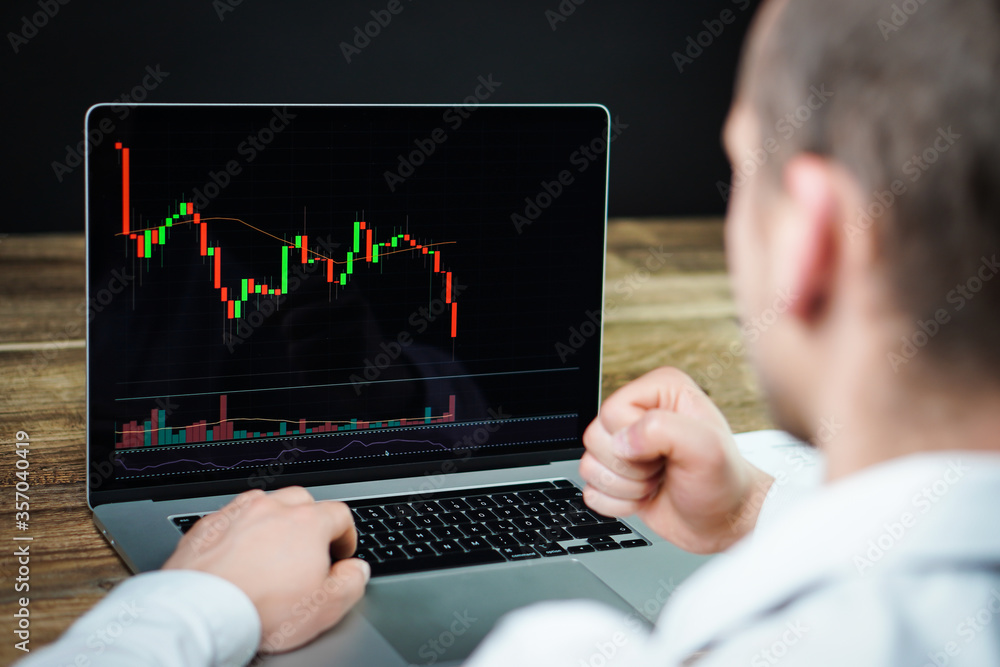 The young crypto and stock trader - investor is trying to prepare for next market collapse. Another crisis is coming and prices on the charts are falling down. The young crypto and stock trader - investor is trying to prepare for next market collapse. Another crisis is coming and prices on the charts are falling down.