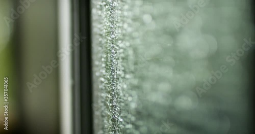 Wallpaper Mural Raindrops on the window. Raindrops falling on a window during a thunderstorm. Shot in 4k. Torontodigital.ca