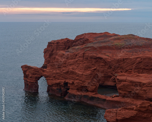 Schilderij op canvas Magdalen Islands red sandstone rocky coastline
