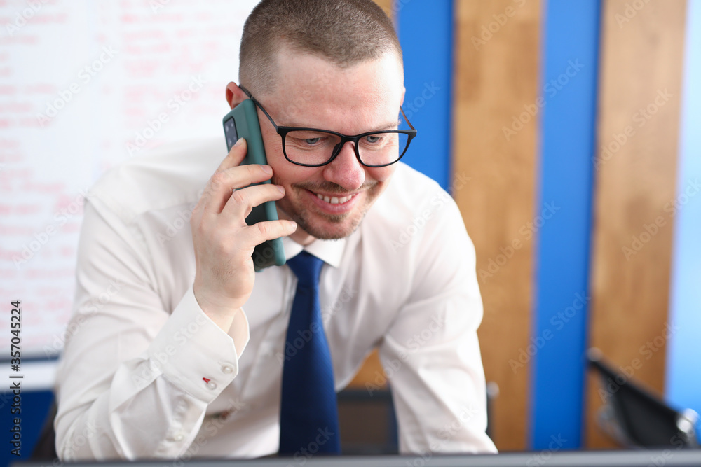 Portrait of smiling person talking on mobile phone and decide important question. Happy cheerful adult in stylish white costume. Career and business growth concept Portrait of smiling person talking on mobile phone and decide important question. Happy cheerful adult in stylish white costume. Career and business growth concept
