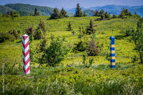 Polish and Ukrainian border poles on Bukowska pass in Bieszczady Mountains, Poland photo