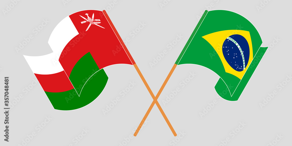 Crossed and waving flags of Oman and Brazil Crossed and waving flags of Oman and Brazil