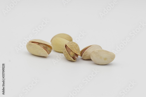 Smiley pistachio Dry fruit on white background, pistachio benefits  photo