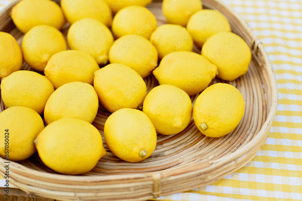 Plate with ripe fresh lemons. Vitamins concept. copy space. Strengthening immunity concept. Tropical fruit. Organic citrus fruits for a healthy diet. Plate with ripe fresh lemons. Vitamins concept. copy space. Strengthening immunity concept. Tropical fruit. Organic citrus fruits for a healthy diet.