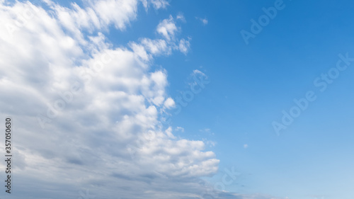 Blue sky background with beautiful white clouds.