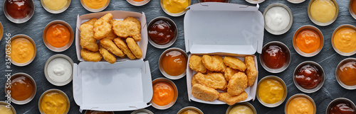 Photography two boxes of fast food fried chicken nuggets with different dipping sauces