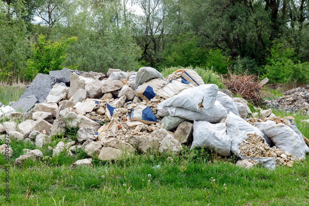 Dump of construction and household garbage in the forest. Dump of construction and household garbage in the forest.