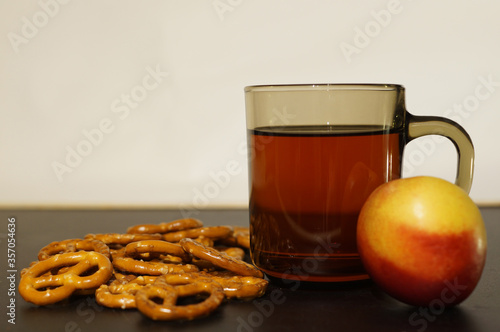 tea and pretzels  and nectarine