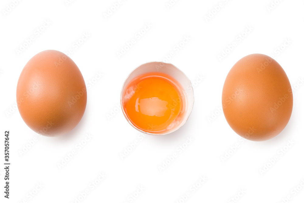 Chicken egg is half broken among other eggs isolated on white background. Top view Chicken egg is half broken among other eggs isolated on white background. Top view