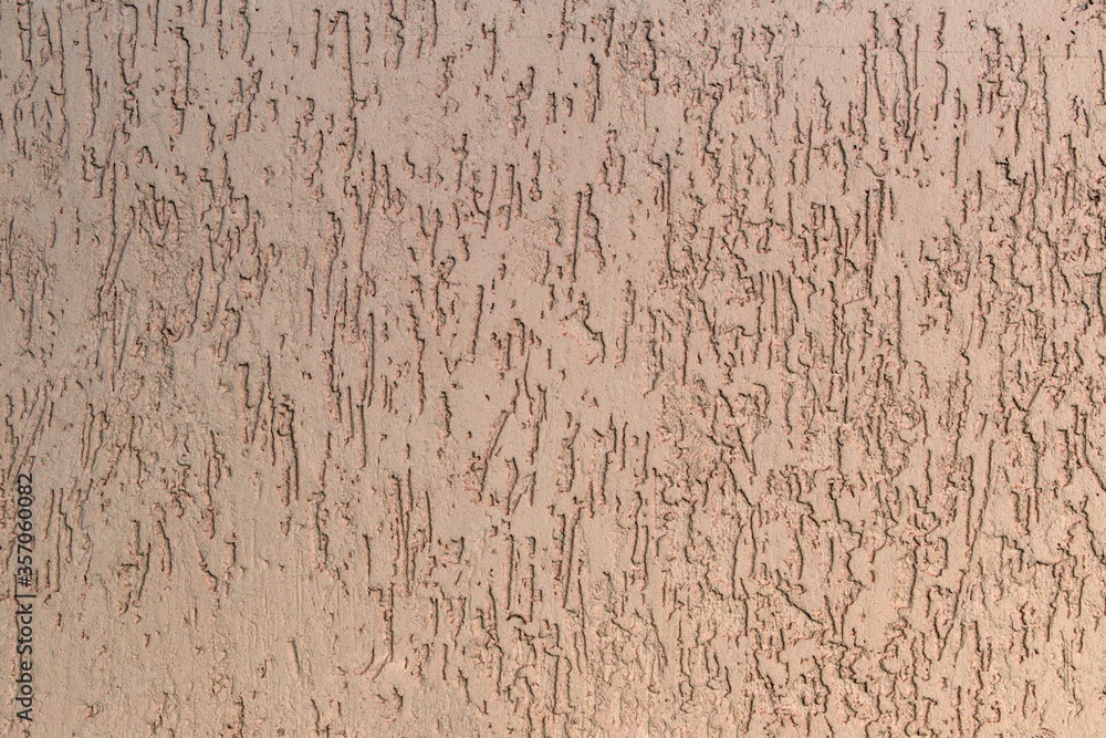 textured plasters pale pink color on the wall