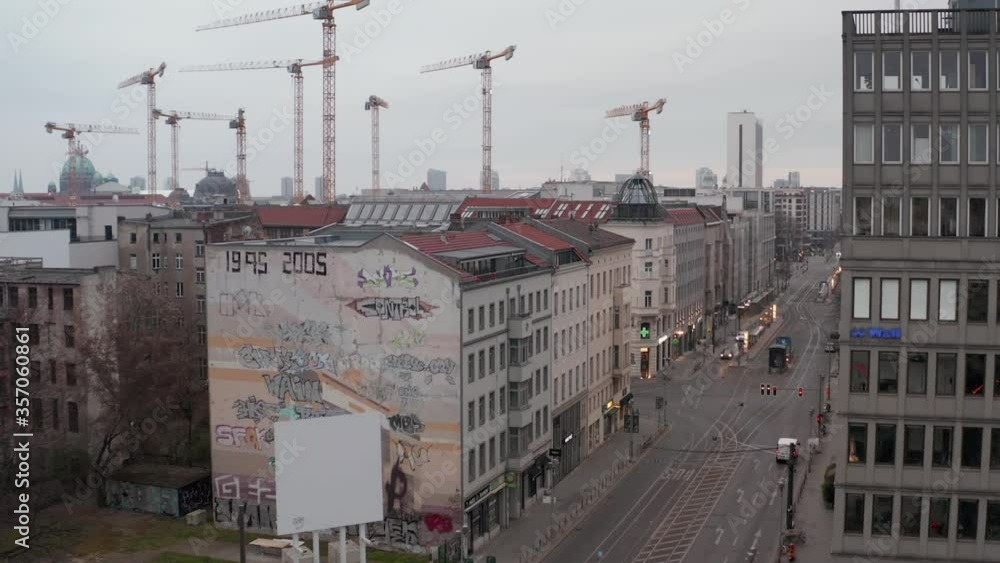 AERIAL: Slow flight through Empty Central Berlin Neighbourhood Street with Almost No People and No Cars during Coronavirus COVID 19 on Overcast Cloudy Day AERIAL: Slow flight through Empty Central Berlin Neighbourhood Street with Almost No People and No Cars during Coronavirus COVID 19 on Overcast Cloudy Day