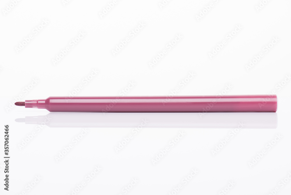 Side profile view close-up photo of light brown marker with cap off isolated on white background Side profile view close-up photo of light brown marker with cap off isolated on white background