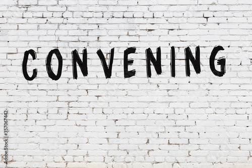 Schilderij op canvas Word convening painted on white brick wall