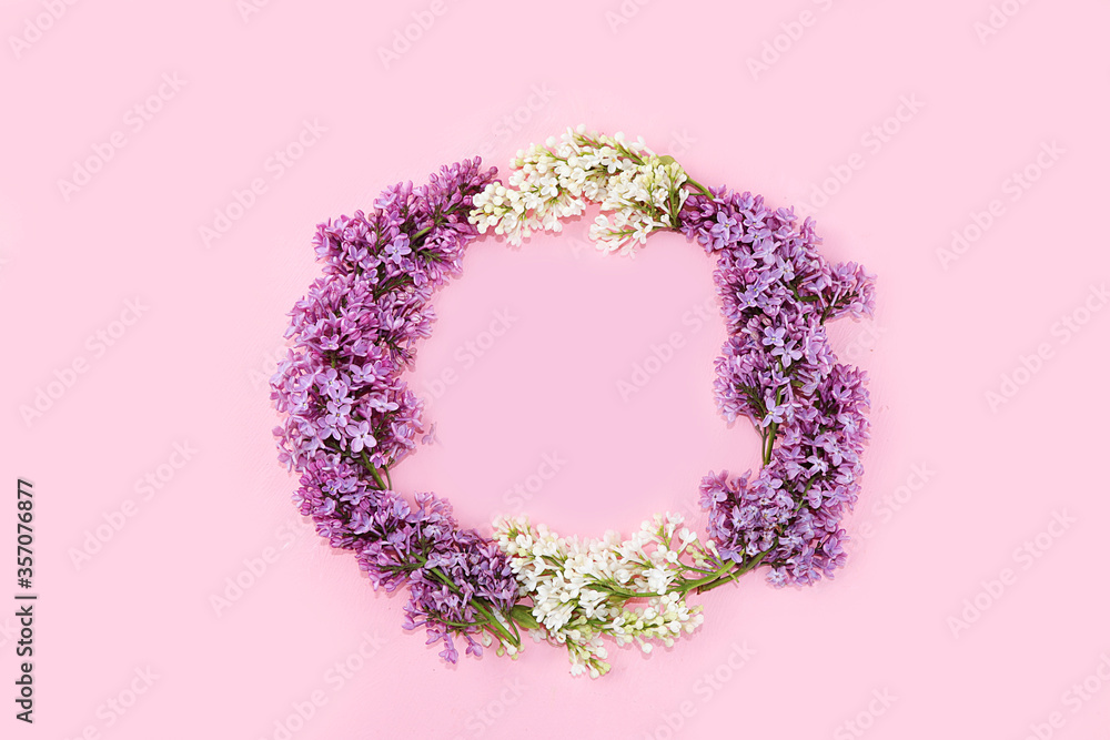 Abstract Floral composition flat lay, background, minimum holiday concept, banner of spring. Creative modern wreath with lilacs. Greeting card for mother's day, happy birthday, wedding