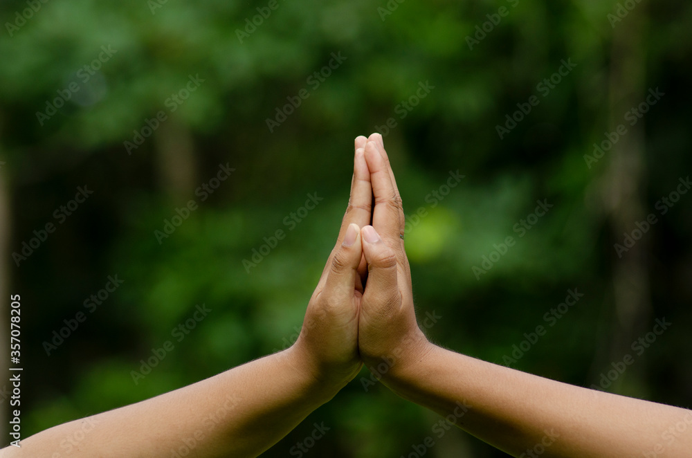 woman's hand is on the green background