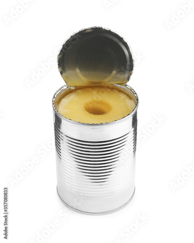 Open tin with canned pineapple isolated on white