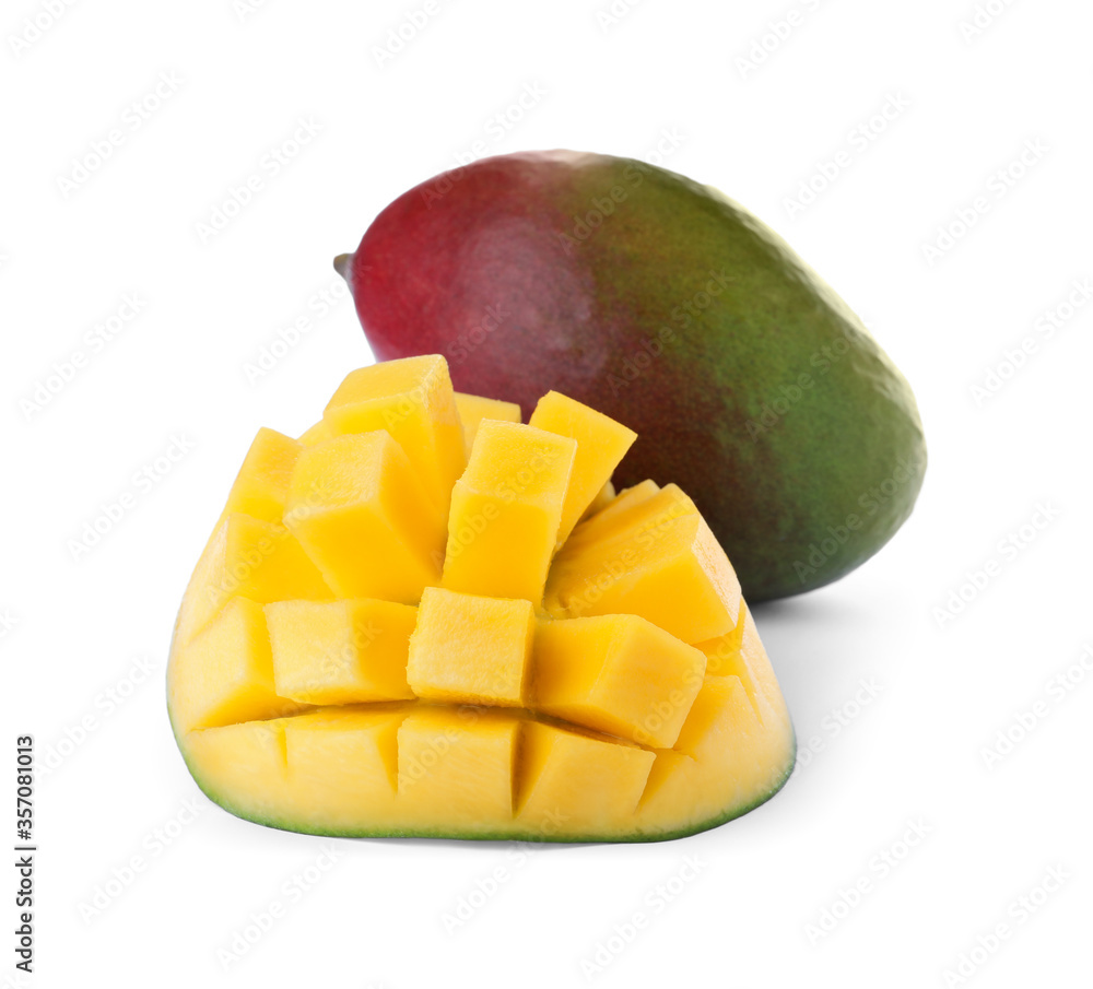 Cut and whole ripe mangoes isolated on white