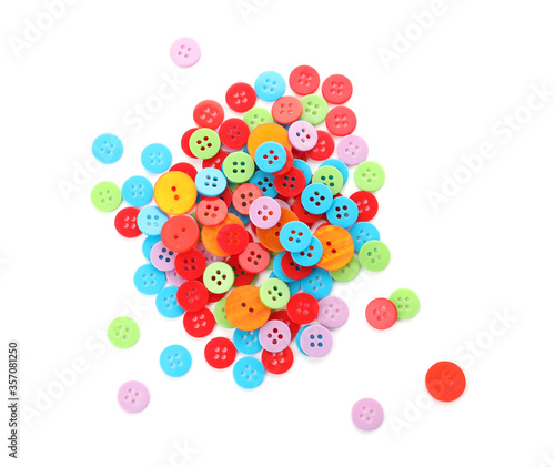 Many colorful plastic sewing buttons isolated on white, top view