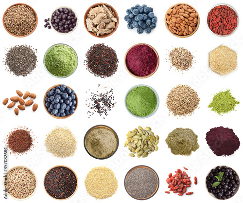 Set of different superfoods on white background, top view photo