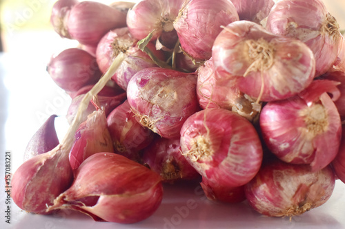 A group of red onion on white background
