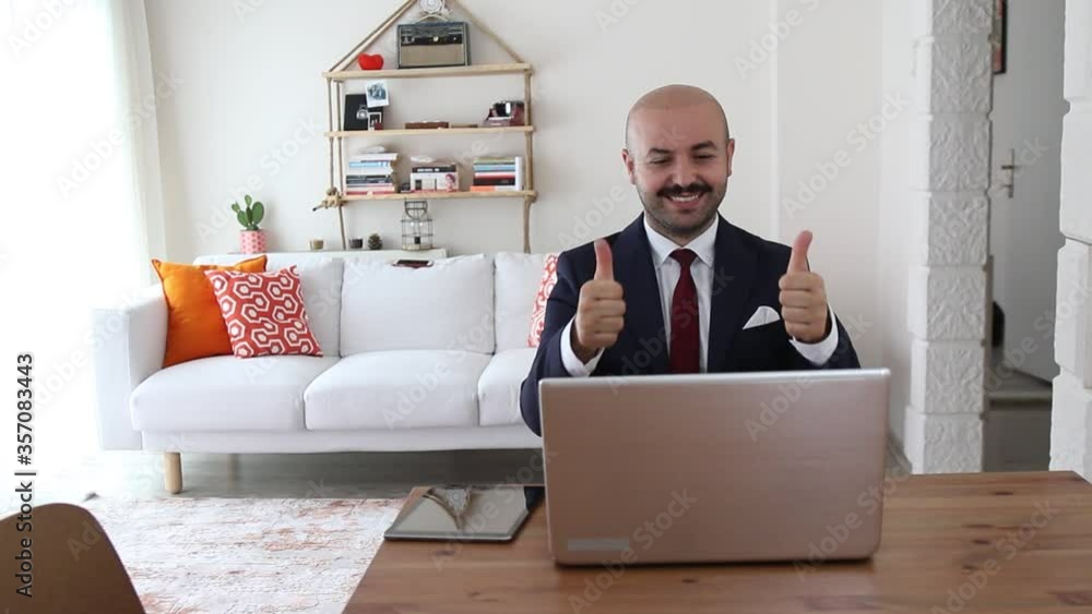 business man in suit rejoices approving at the meeting with leptop business man in suit rejoices approving at the meeting with leptop