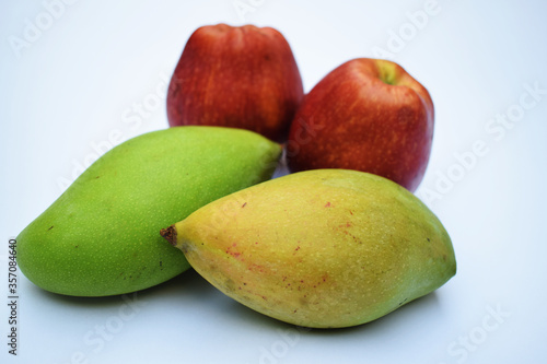 Totapuri mango or Bangalora mango with Fresh red  apples nutritious photo