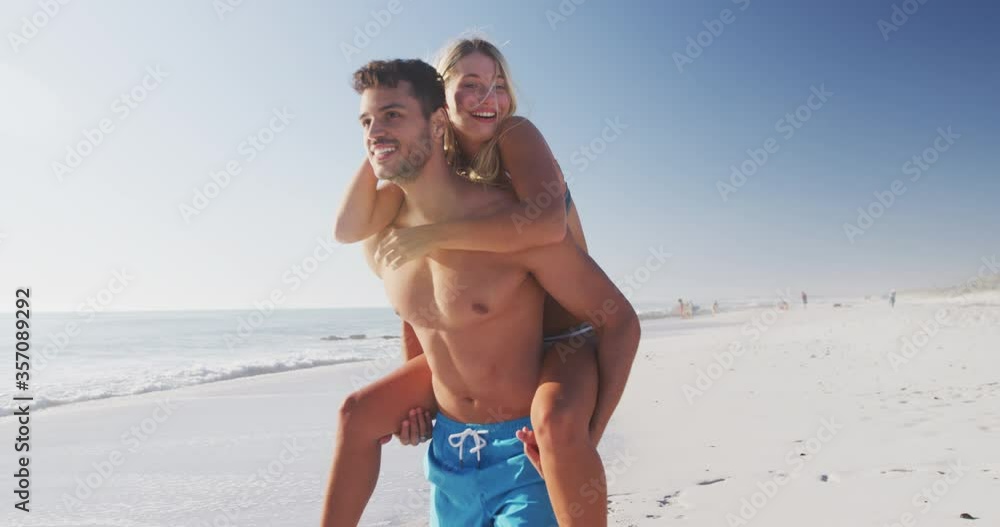 Caucasian couple enjoying time at the beach Caucasian couple enjoying time at the beach