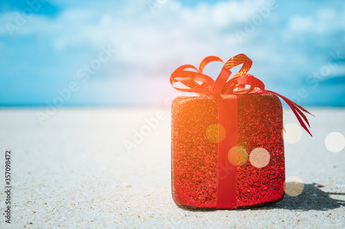 Gift boxes on sandy beach. Hot tours or holiday vacation concept with summer sea.