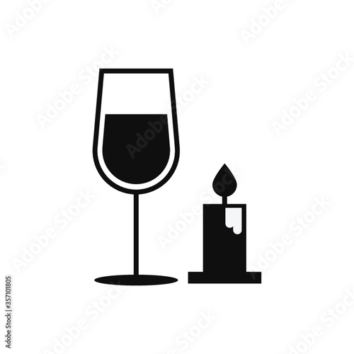 glass of wine with candle
