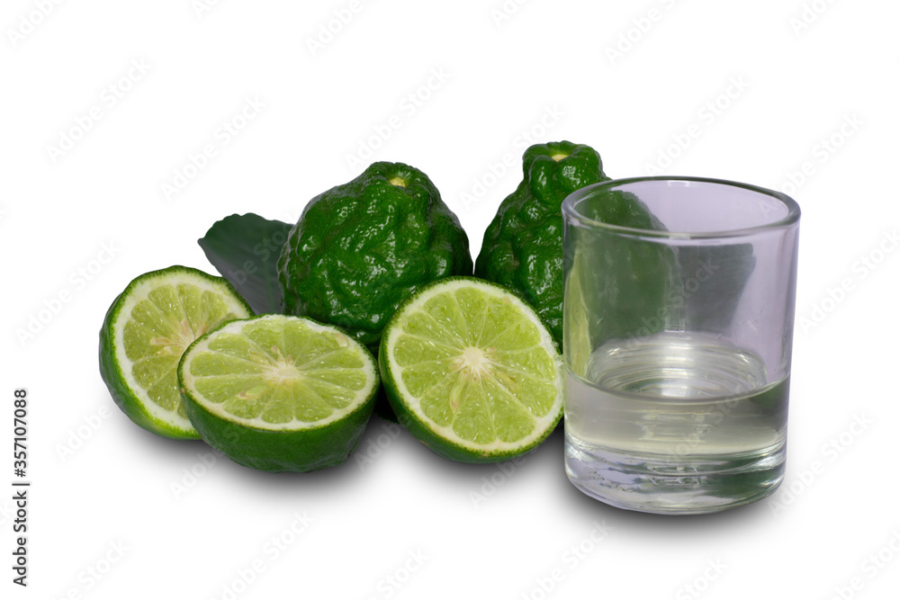 Bergamot citrus fruit essential oil in glass and fresh bergamot fruit on white background. Bergamot citrus fruit essential oil in glass and fresh bergamot fruit on white background.