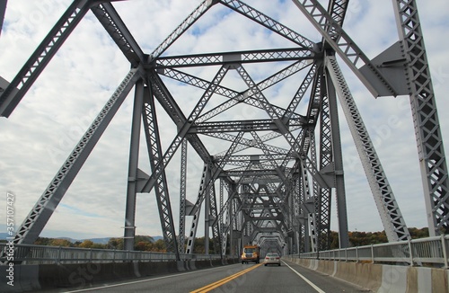 A metal bridge view from below.