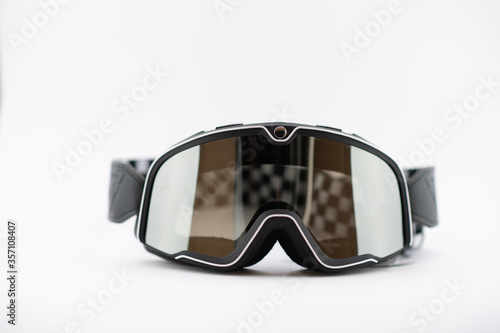 A pair of used motorcycle motocross goggles isolated on white