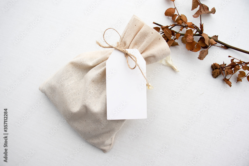 Blank white gift tag or wedding favor tag mockup with autumnal colours